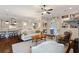 Inviting living room featuring hardwood floors, fireplace, built-in bookshelves, and seamless flow to kitchen at 4224 Dogwood Bend Park, Duluth, GA 30096