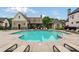 Community pool featuring lounge chairs and a pergola-covered seating area at 4224 Dogwood Bend Park, Duluth, GA 30096