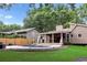 Beautiful backyard view showcasing the patio, pool, outdoor kitchen, and lush lawn at 657 Polk Nw St, Marietta, GA 30064
