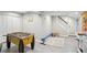 Finished basement with foosball table, white painted doors and trim, and painted concrete flooring at 657 Polk Nw St, Marietta, GA 30064