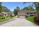 Charming home with a two-car garage, inviting blue front door, and neatly kept landscaping at 657 Polk Nw St, Marietta, GA 30064