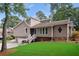Charming two-story home with a well-maintained lawn, manicured landscaping, and inviting entrance at 657 Polk Nw St, Marietta, GA 30064