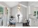 Bright and modern kitchen features new fixtures, stainless steel appliances, stone countertops and custom lighting at 657 Polk Nw St, Marietta, GA 30064