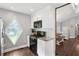 A well-lit kitchen features granite counters, stainless steel appliances, and a unique diamond shaped window at 657 Polk Nw St, Marietta, GA 30064