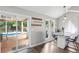Kitchen featuring a marble breakfast bar and sliding glass doors leading to a covered deck and pool at 657 Polk Nw St, Marietta, GA 30064