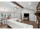 Open-concept living room with vaulted ceilings, hardwood floors, a fireplace, and plenty of natural light at 657 Polk Nw St, Marietta, GA 30064