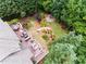 Aerial view of the home’s deck that leads to a firepit area and meticulous landscaping at 702 Crescent Cir, Canton, GA 30115