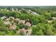 Wide aerial shot showing neighborhood and property location with mature trees at 702 Crescent Cir, Canton, GA 30115