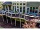 Multi-tiered back deck with ample seating, tables and beautiful backyard views at 702 Crescent Cir, Canton, GA 30115