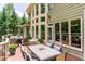 Large back deck with an outdoor dining set and comfortable seating area at 702 Crescent Cir, Canton, GA 30115