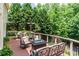 Inviting back deck featuring comfortable seating and a warm fire table at 702 Crescent Cir, Canton, GA 30115