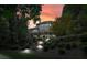 Backyard of home featuring multi-level deck and patio and landscaped garden at 702 Crescent Cir, Canton, GA 30115