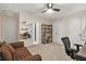 Bedroom with carpeted floors features a desk, chair, ceiling fan, closet and sofa at 702 Crescent Cir, Canton, GA 30115