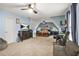 Spacious bedroom featuring light blue walls, plush carpet, a ceiling fan, and a TV on the dresser at 702 Crescent Cir, Canton, GA 30115