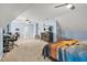 A large bedroom with light blue accent walls, two ceiling fans, a dresser with television, and lots of room at 702 Crescent Cir, Canton, GA 30115