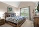 Comfortable bedroom features carpeted floors, TV, a dresser and a large window for plenty of natural light at 702 Crescent Cir, Canton, GA 30115