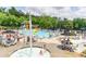 Community pool area with a zero entry wading pool, splash pad, and plenty of seating at 702 Crescent Cir, Canton, GA 30115