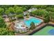 Aerial view of the community pool with lounge chairs, tables, and water features at 702 Crescent Cir, Canton, GA 30115