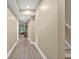 Well-lit hallway with durable wood-look flooring that leads to the stairs and the living area at 702 Crescent Cir, Canton, GA 30115