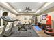 Well-equipped home gym featuring a treadmill, weights, and punching bag at 702 Crescent Cir, Canton, GA 30115