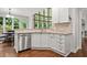 Kitchen with stainless steel dishwasher, lots of natural light, and ample countertop space at 702 Crescent Cir, Canton, GA 30115