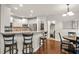 Open kitchen/breakfast nook area featuring bar stool seating, a round kitchen table, and laundry nook access at 702 Crescent Cir, Canton, GA 30115