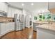 Well-lit kitchen with stainless steel appliances, granite countertops, and a view of the outdoors at 702 Crescent Cir, Canton, GA 30115