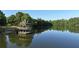 Picturesque lake house with gazebo, perfect for relaxation and waterfront enjoyment at 702 Crescent Cir, Canton, GA 30115
