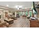 Spacious living room with light-colored walls, lots of natural light, and wood-look floors at 702 Crescent Cir, Canton, GA 30115