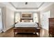 The Main Bedroom features tray ceilings and hardwood floors at 702 Crescent Cir, Canton, GA 30115