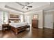 Spacious Main Bedroom showing tray ceilings, closet and attached bath at 702 Crescent Cir, Canton, GA 30115