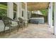 Relax on this patio space with outdoor furniture and a luxurious hot tub at 702 Crescent Cir, Canton, GA 30115