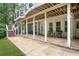 Enjoy the outdoor space with seating, covered area, and access to backyard at 702 Crescent Cir, Canton, GA 30115