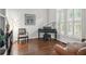 Elegant piano room with hardwood floors, natural light, and neutral colors at 702 Crescent Cir, Canton, GA 30115