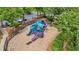 Bright and colorful community playground with slides, climbing structures, and cushioned ground cover at 702 Crescent Cir, Canton, GA 30115