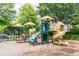 Community playground with slides and climbing structures for outdoor fun at 702 Crescent Cir, Canton, GA 30115