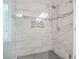 Bright shower features designer tile and glass door at 702 Crescent Cir, Canton, GA 30115