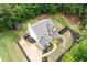 Aerial view of a home with a large backyard, patio, manicured landscaping, and perimeter fence at 1417 Woodrow Kay Rd, Rockmart, GA 30153