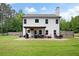 Spacious backyard with patio, pergola, swing set, and privacy fence at 1417 Woodrow Kay Rd, Rockmart, GA 30153