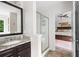 Bathroom with granite vanity, framed mirror, shower, and access to main bedroom at 1417 Woodrow Kay Rd, Rockmart, GA 30153