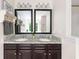 Bathroom featuring dual sinks, granite countertops, and black framed mirrors at 1417 Woodrow Kay Rd, Rockmart, GA 30153
