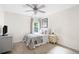 Neutral bedroom with a ceiling fan, carpet, and bright window for ample natural light at 1417 Woodrow Kay Rd, Rockmart, GA 30153