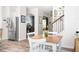 A bright breakfast nook features an arched doorway, wood floors, and seating for four at 1417 Woodrow Kay Rd, Rockmart, GA 30153