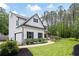 Charming home featuring a well-maintained lawn, walkway, black shutters, stone accents, and a two car garage at 1417 Woodrow Kay Rd, Rockmart, GA 30153