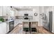 Modern kitchen with stainless steel appliances, a center island with bar seating, and granite countertops at 1417 Woodrow Kay Rd, Rockmart, GA 30153