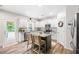 Bright kitchen featuring white cabinets, granite countertops, and an island with seating at 1417 Woodrow Kay Rd, Rockmart, GA 30153