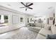The bright living area features natural light, wood-look flooring, and an open view to the kitchen at 1417 Woodrow Kay Rd, Rockmart, GA 30153