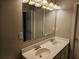 Bathroom with double sink vanity and updated lighting at 2137 Meadow Peak Rd, Duluth, GA 30097