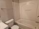Full bathroom features a white tub and shower combo with a matching toilet and vanity at 2137 Meadow Peak Rd, Duluth, GA 30097