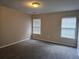 Spacious bedroom with neutral walls and two windows for ample natural light at 2137 Meadow Peak Rd, Duluth, GA 30097